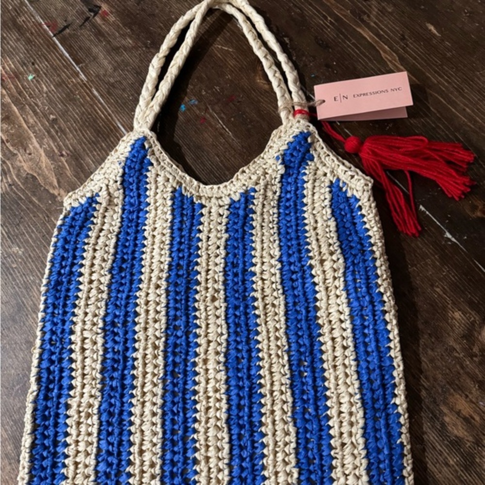 Expressions NYC stioed tote w/red tassel detail, snap closure, inner lining….